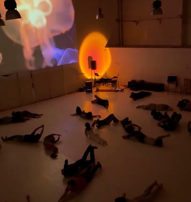 People lying on the floor, orange light