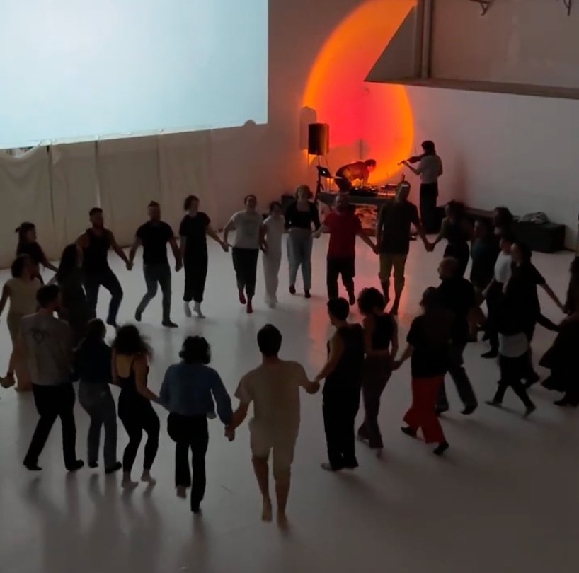 Circle of dancers holding hands