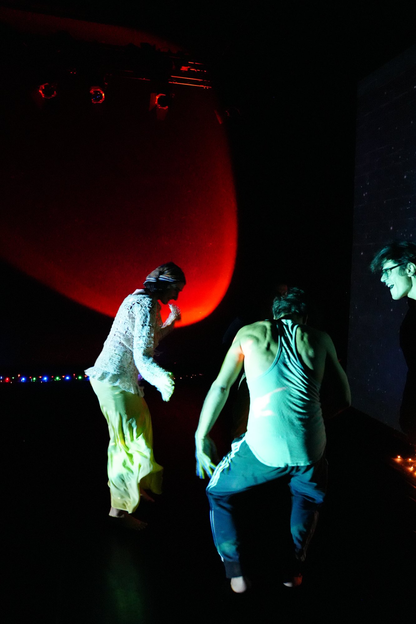 Dancers in red and green light